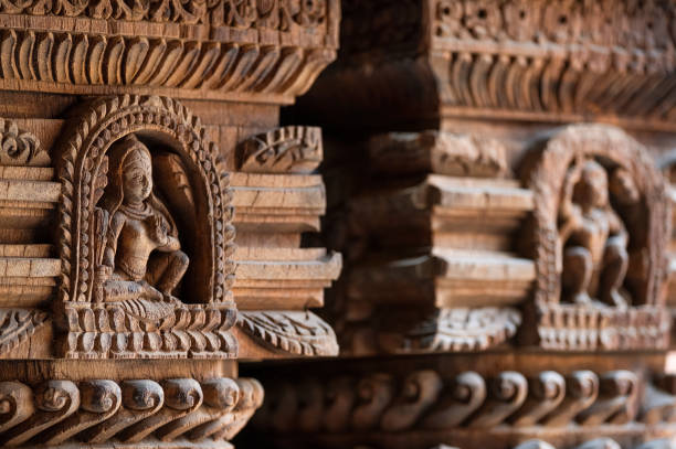 Carved wood wall decoration in Patan Durbar Square royal medieval palace and UNESCO World Heritage Site. Lalitpur, Nepal. Carved wood wall decoration in Patan Durbar Square royal medieval palace and UNESCO World Heritage Site. Lalitpur, Nepal. patan durbar square stock pictures, royalty-free photos & images