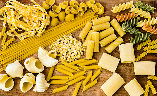 istock Pasta Variation on a Wooden Cutting Board 177725185