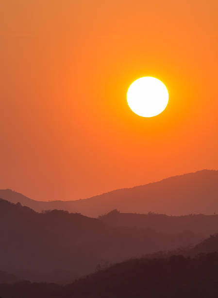 istock Orange Sunset behind a hilly landscape 177725375