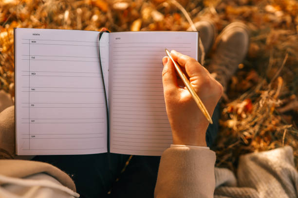 istock Girl with paper planner outdoors, autumn concept 1777255194