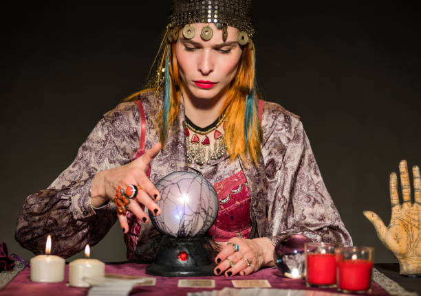 istock Fortune teller reading future in dark room 1777256312