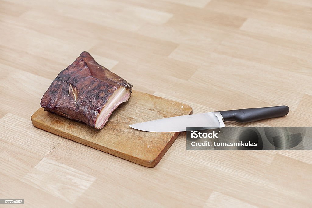 Homemade Smoked Meat On Wooden Cutting Board With Big Knife Stock