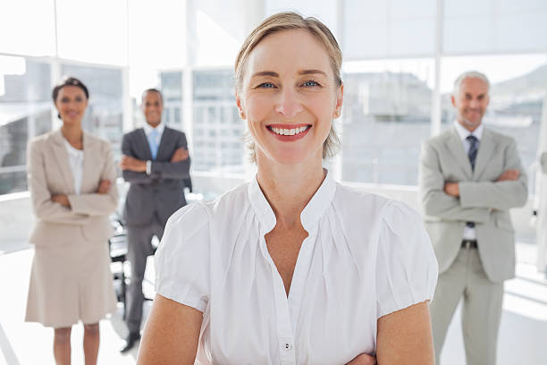 istock Cheerful businesswoman standing with arms folded 177726567
