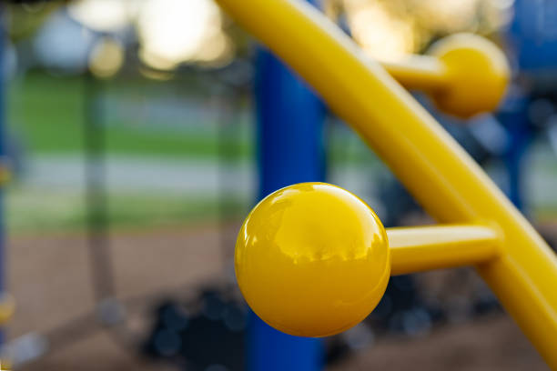 Unidentified typical elementary school playground with engineered wood fiber safety fall surface