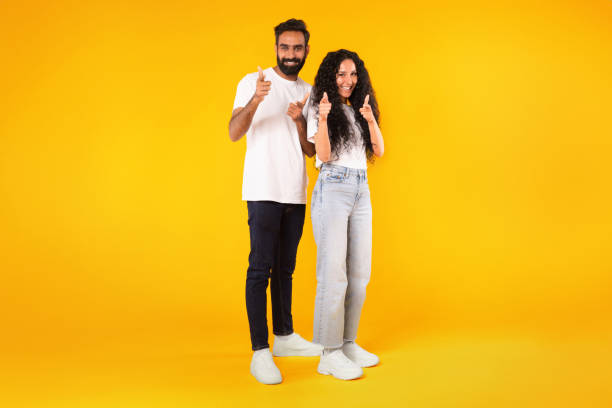 istock Arabic man and woman pointing at camera on yellow background 1777267784