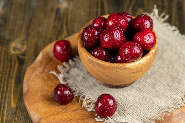 istock covered with drops of water ripe red cherries on the table 1777271703
