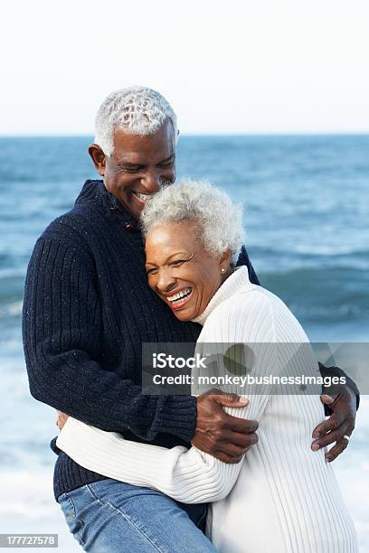 Elderly Black Couple Hugging On Beach Stock Photo - Download Image Now - Senior Couple, African Ethnicity, African-American Ethnicity