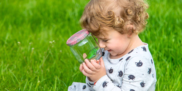 istock Child in nature with a lizard. Selective focus. 1777277310