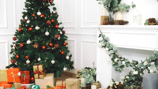 istock Background Christmas tree decorated holiday winter xmas celebration present gift decorate bauble ornament golden ball in cozy living room. Merry Christmas happy new year festival traditional concept 1777278525
