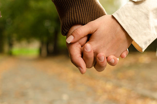istock Man and woman holding hands 177728367