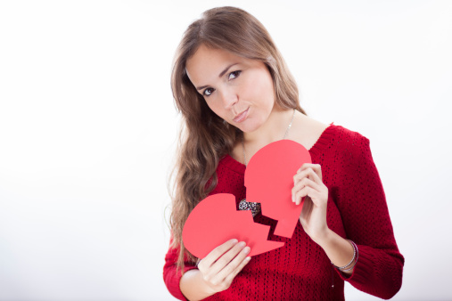 Sad young woman with a broken heart