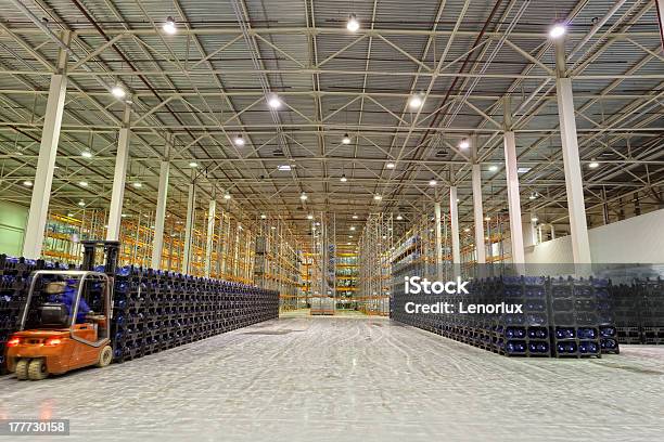 Forklift Moving Plastic Stackable Crates In A Warehouse Stock Photo - Download Image Now