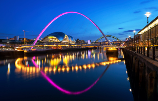 The Gateshead Millennium Bridge is a pedestrian and cyclist tilt bridge spanning the River Tyne in England between Gateshead's Quays arts quarter on the south bank, and the Quayside of Newcastle upon Tyne on the north bank. image no 190.