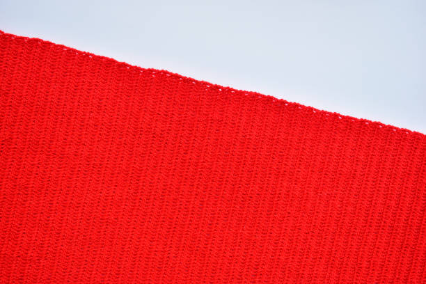 istock red wool knitted yarn texture, woolen fabric on white background 1777326731