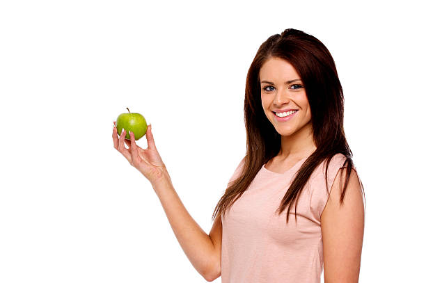 istock Brunette woman holding up an apple 177733287