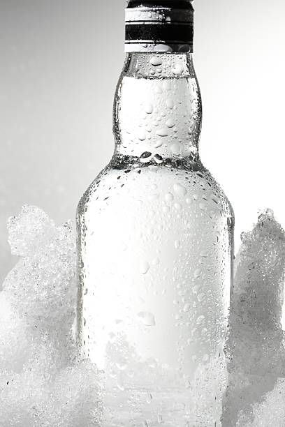 Close up view of the bottle in ice stock photo