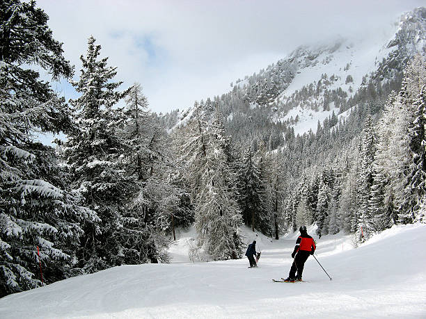crans montana Scenic view of ski slopes in resort of crans montana with mountains in background, valais, switzerland. crans montana stock pictures, royalty-free photos & images