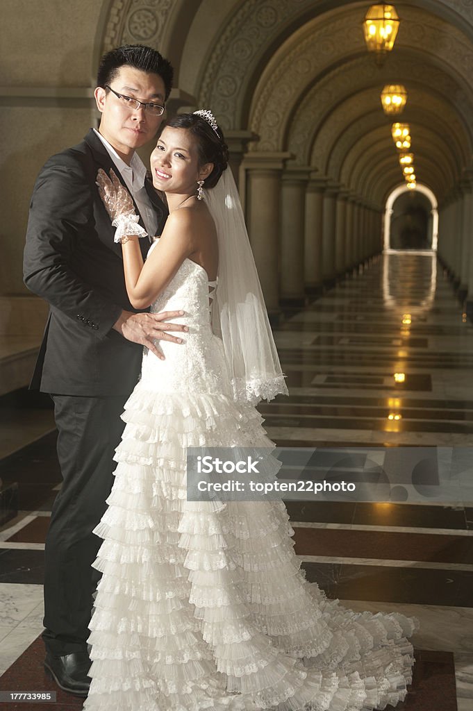 Happy bride and groom A beautiful bride and handsome groom at Christian church during wedding . Adult Stock Photo