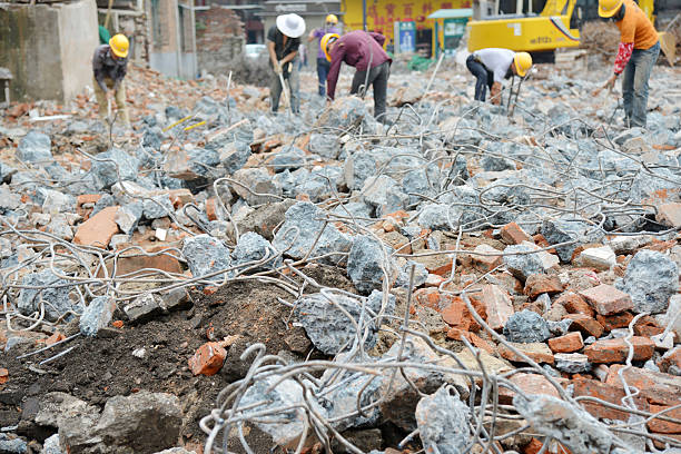 The workers demolishing buildings stock photo