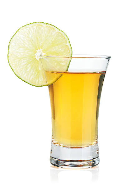 istock Shot of gold tequila with lime slice 177734363
