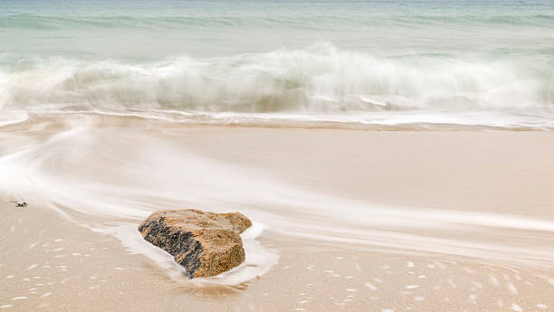 istock Beautiful yellow sand beach with emerald ocean and rocks 177734639