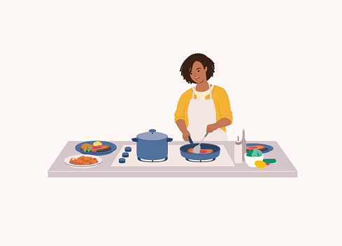 One Smiling Black Woman With Apron Cooking Steak With Frying Pan At Kitchen Stovetop. Isolated On Color Background.