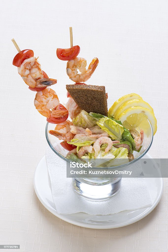 Salad from seafood Salad from seafood. Shrimps with tomatoes on a stick Buffet Stock Photo