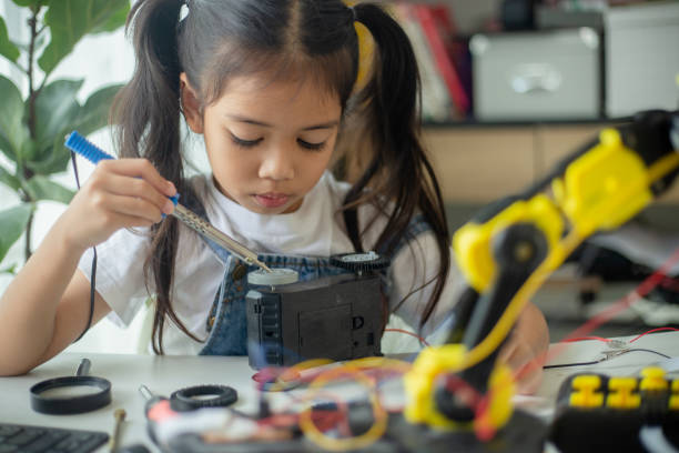 istock STEM education concept. Asian young girl learning robot design. 1777358183
