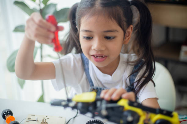 istock STEM education concept. Asian young girl learning robot design. 1777358211