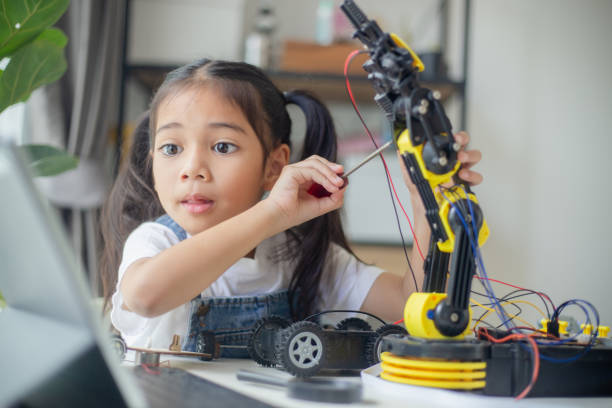 istock STEM education concept. Asian young girl learning robot design. 1777358213