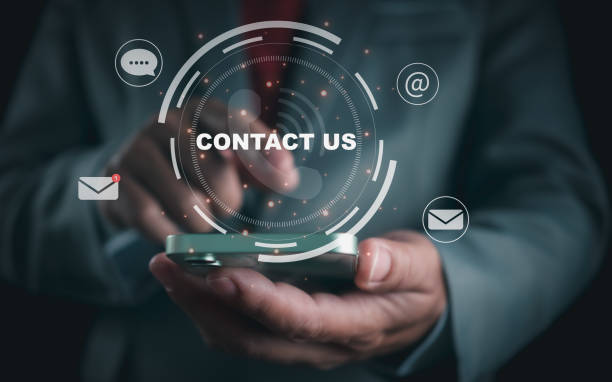 istock Website page, contact us or email marketing concept, customer support hotline, contact us. Businessman sitting and working on computer. Email, phone, address, chat message icon. 1777368967