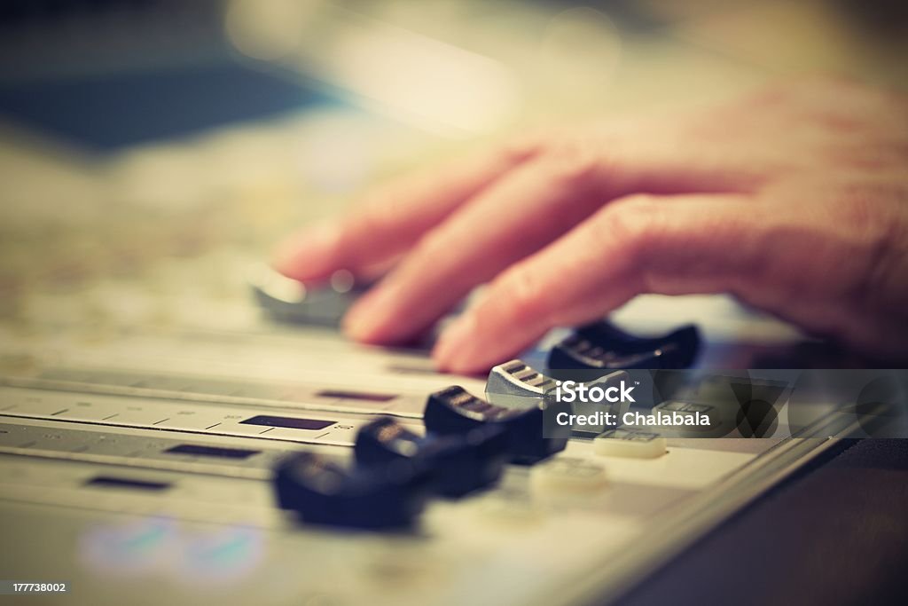 Mixing Board Professional audio mixing console with faders and adjusting knobs - radio / TV broadcasting Arts Culture and Entertainment Stock Photo