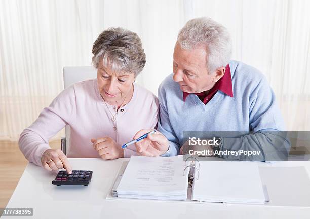 Senior Couple Calculating Budget Stock Photo - Download Image Now - Accounting Ledger, Active Seniors, Adult