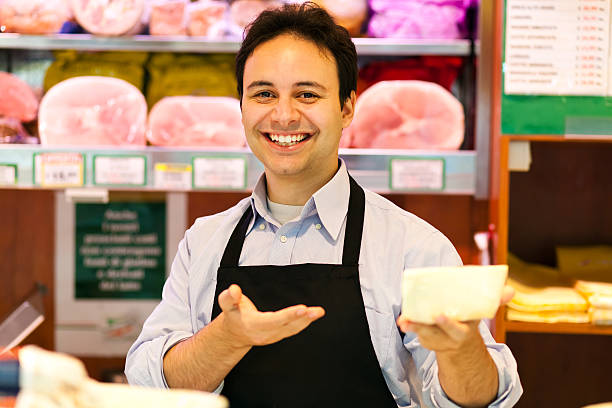 uśmiech właściciel sklepu w jego supermarket - butchers shop meat sausage store zdjęcia i obrazy z banku zdjęć