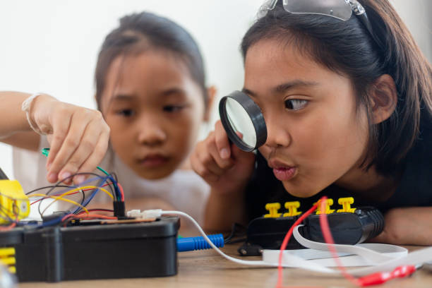 istock nventive kids learn at home by coding robot cars and electronic board cables in STEM. constructing robot cars at home 1777390432