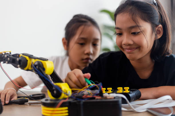 istock nventive kids learn at home by coding robot cars and electronic board cables in STEM. constructing robot cars at home 1777390437