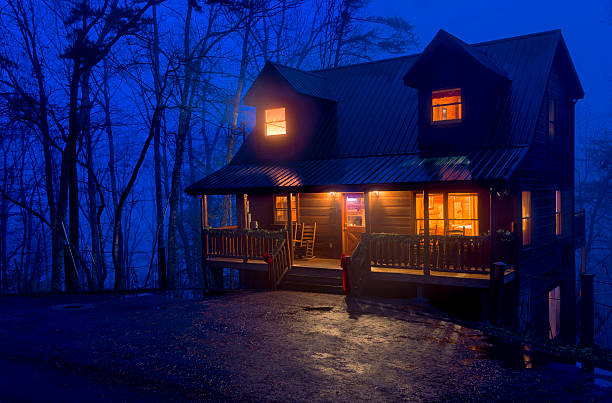 Cabin in the Mountains at night stock photo