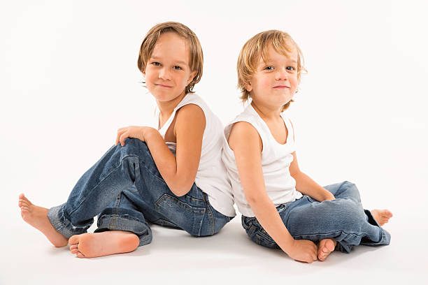 istock Two brothers sitting against each other 177739537