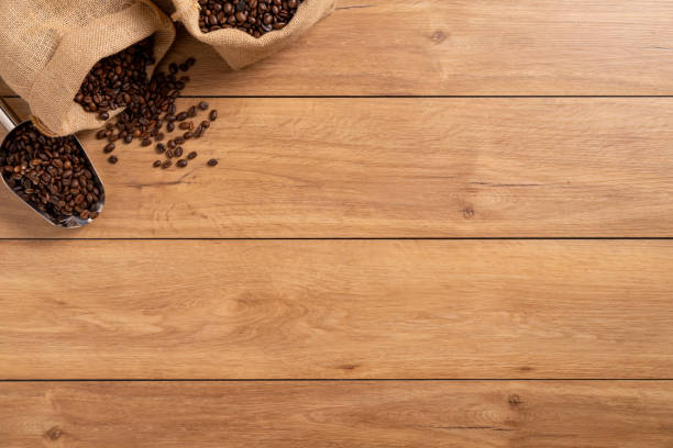 istock The many coffee beans are placed around on a wooden table 1777404542