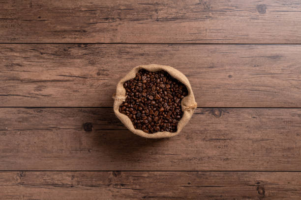 istock The many coffee beans are placed around on a wooden table 1777404553