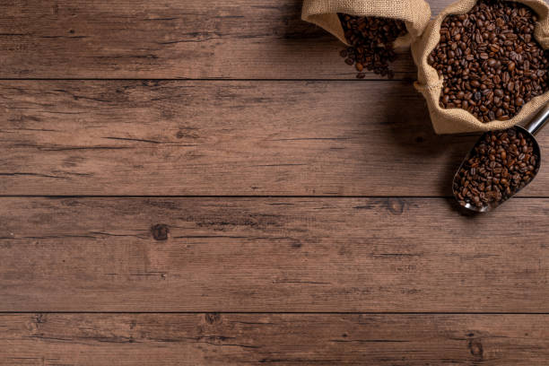 istock The many coffee beans are placed around on a wooden table 1777405090