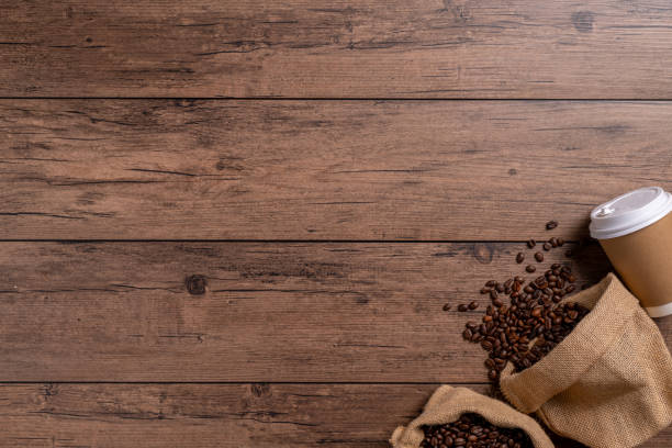istock The many coffee beans are placed around on a wooden table 1777405099