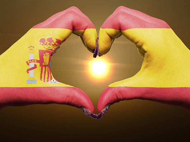 istock Heart and love gesture by hands colored in spain flag 177740984