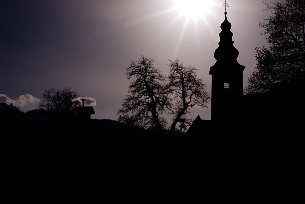 Mountain Church silouette in the Alps