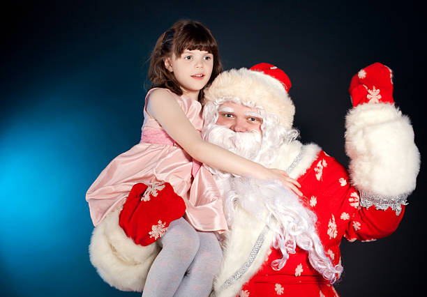 istock Santa holding girl on his shoulder 177741659