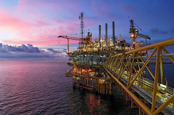 Photo of offshore rig in twilight