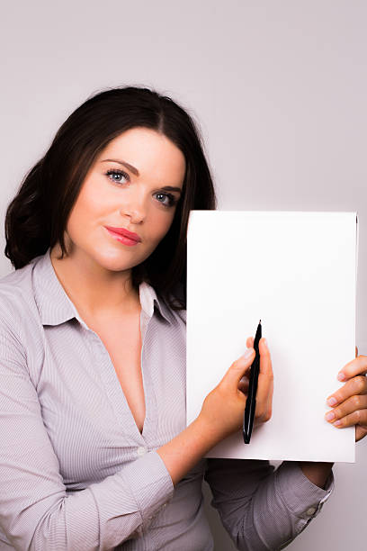 istock Business women taking notes on a pad with pen 177744299