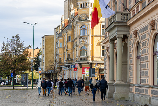 Brasov, Romania - 5 Nov 2023 - Visitors walking amidst restaurants on Strada Republicii. High quality photo