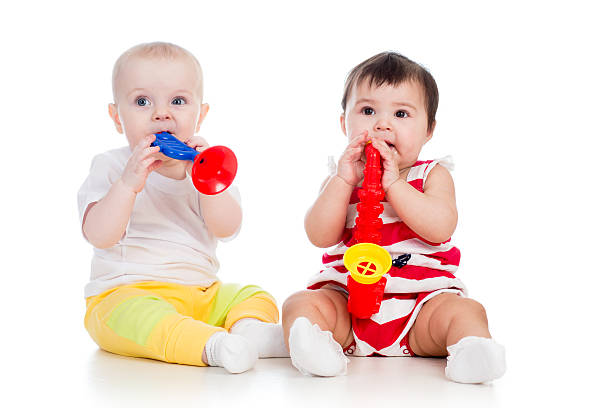 istock Funny babies girls  with musical toy 177745038