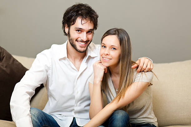 istock Young couple relaxing on the sofa 177745096